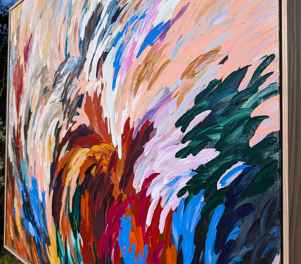 Bold statement texture abstract painting with details and with energetic but calm colors of red, blue, neutral earthy tones in an oak frame